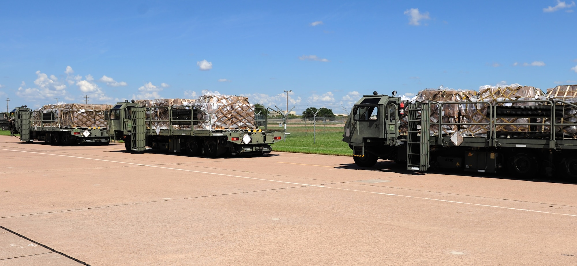 U.S. Air Force K Loaders standby in preparation for loading Global Samaritan Resources’ pallets of food as part of a humanitarian assistance mission at Dyess Air Force Base, Texas, Sept. 20, 2016. The shipment contained approximately 475,000 servings of fortified dehydrated food that will be used to help feed Iraqi refugees. (U.S. Air Force photo by Airman 1st Class April Lancto)