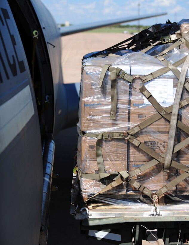 Packed food donations from Global Samaritan Resources is transferred from a loading vehicle to a KC-10 Extender at Dyess Air Force Base, Texas, Sept. 20, 2016. Global Samaritan Resources has shipped approximately 1.6 million servings of food over the course of the year to Iraq. (U.S. Air Force photo by Airman 1st Class April Lancto)