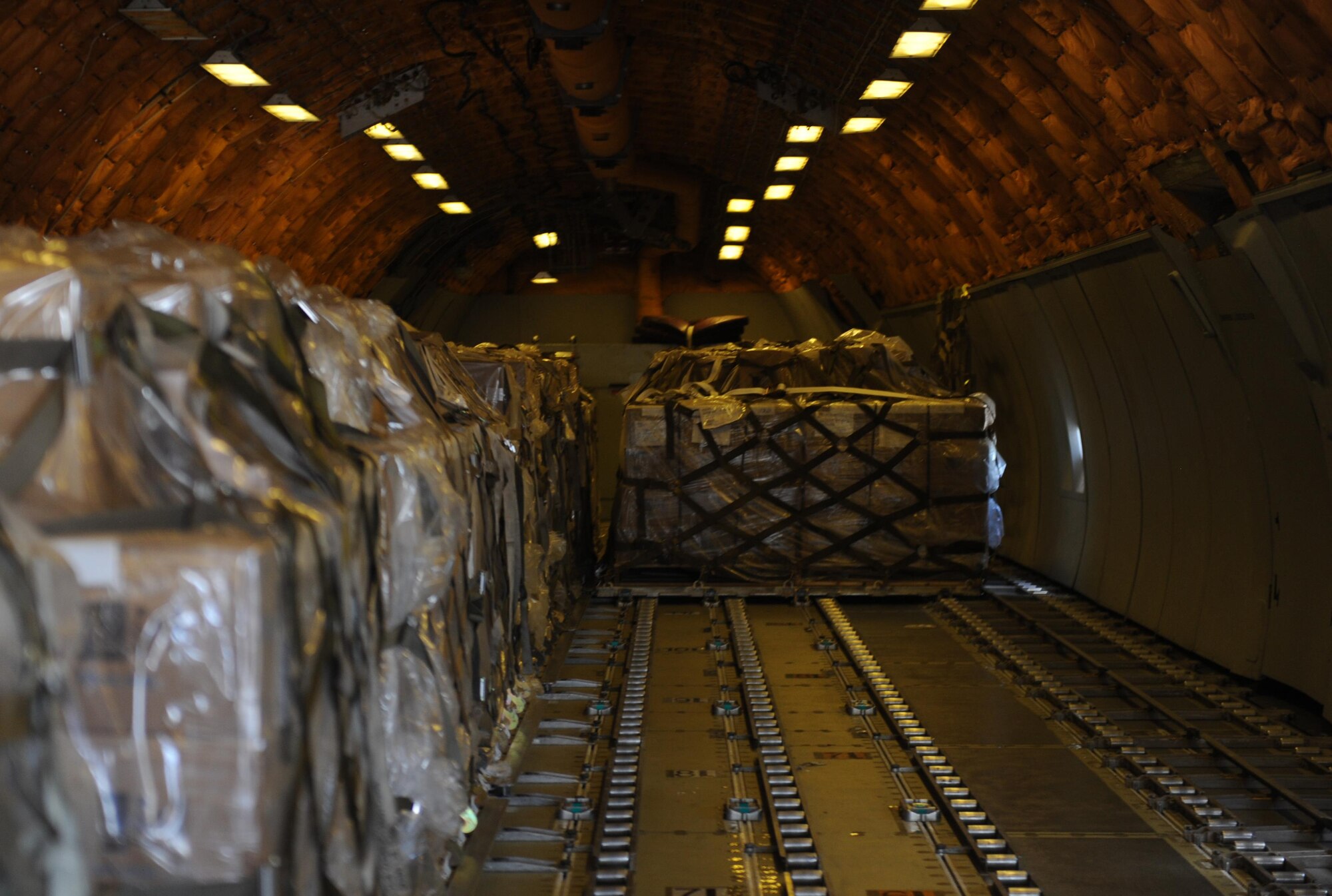 Packed fortified dehydrated food from Global Samaritan Resources are loaded onto a KC-10 Extender at Dyess Air Force Base, Texas, Sept. 20, 2016. Each serving of the food contained in these shipments contains the daily nutritional value for an average adult. (U.S. Air Force photo by Airman 1st Class Rebecca Van Syoc)
