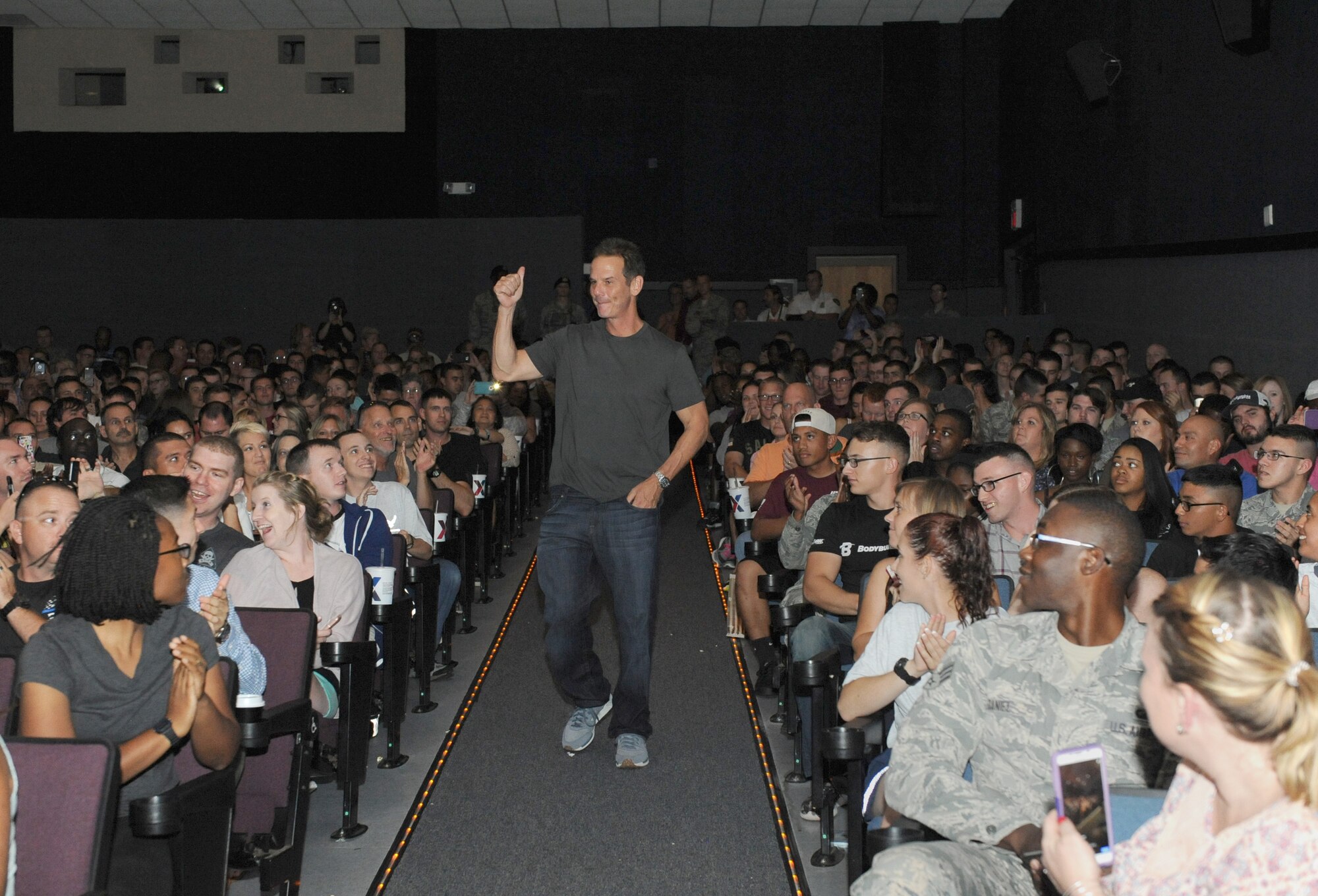 Peter Berg, Deepwater Horizon director, walks into the Welch Theater before the Deepwater Horizon movie screening Sept. 20, 2016, on Keesler Air Force Base, Miss. Before the screening, Kurt Russell, Kate Hudson, Deepwater Horizon actors, and Berg took a short tour of the 81st Training Wing and 403rd Wing to meet with Airmen and learn about their missions at Keesler. (U.S. Air Force photo by Kemberly Groue/Released)