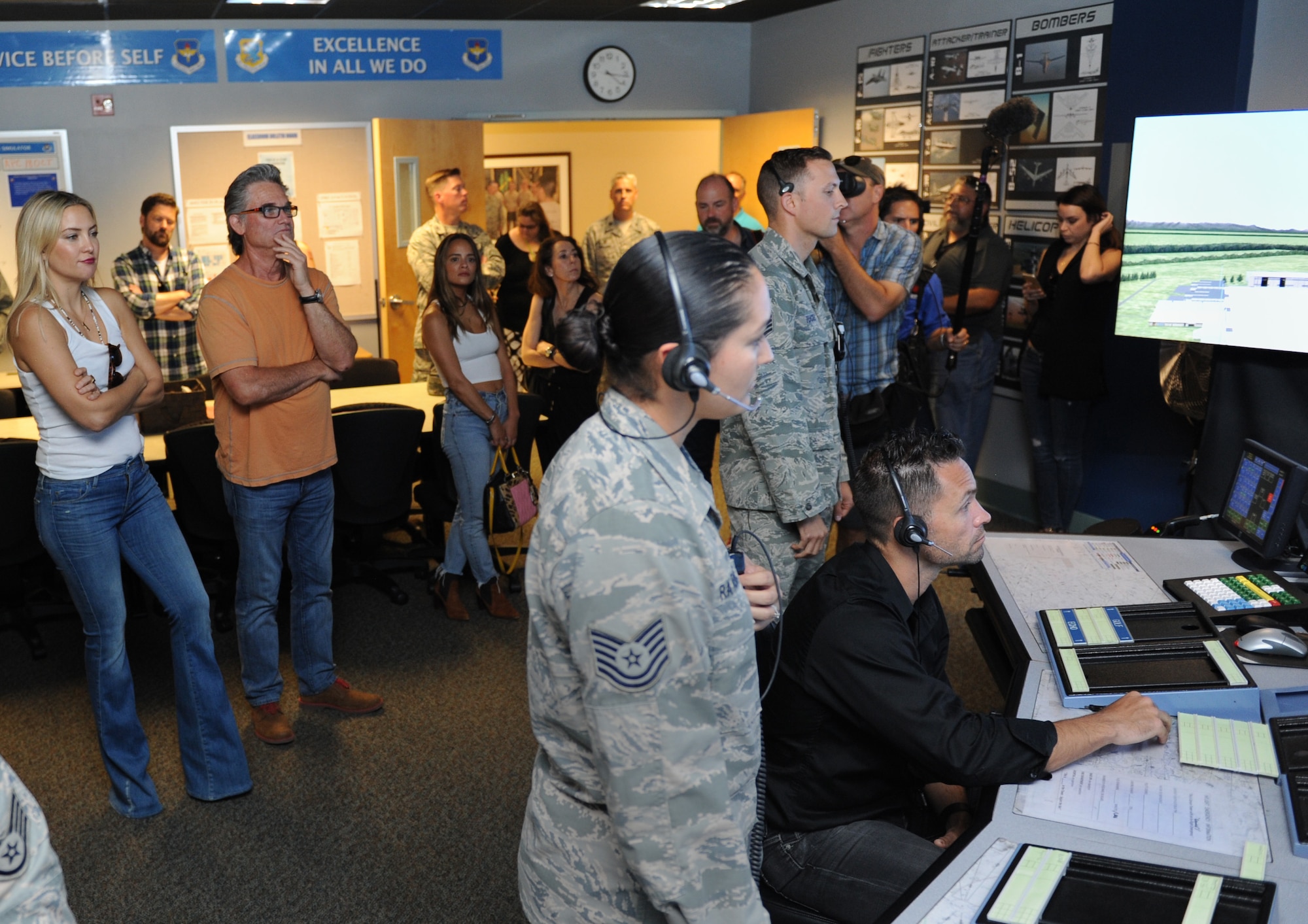 Kate Hudson and Kurt Russel, Deepwater Horizon actors, receive a tour of the 334th Training Squadron air traffic control tower simulator at Cody Hall before the Deepwater Horizon movie screening Sept. 20, 2016, on Keesler Air Force Base, Miss. Before the screening, Russell, Hudson and movie director, Peter Berg, took a short tour of the 81st Training Wing and 403rd Wing to meet with Airmen and learn about their missions at Keesler. (U.S. Air Force photo by Kemberly Groue/Released)