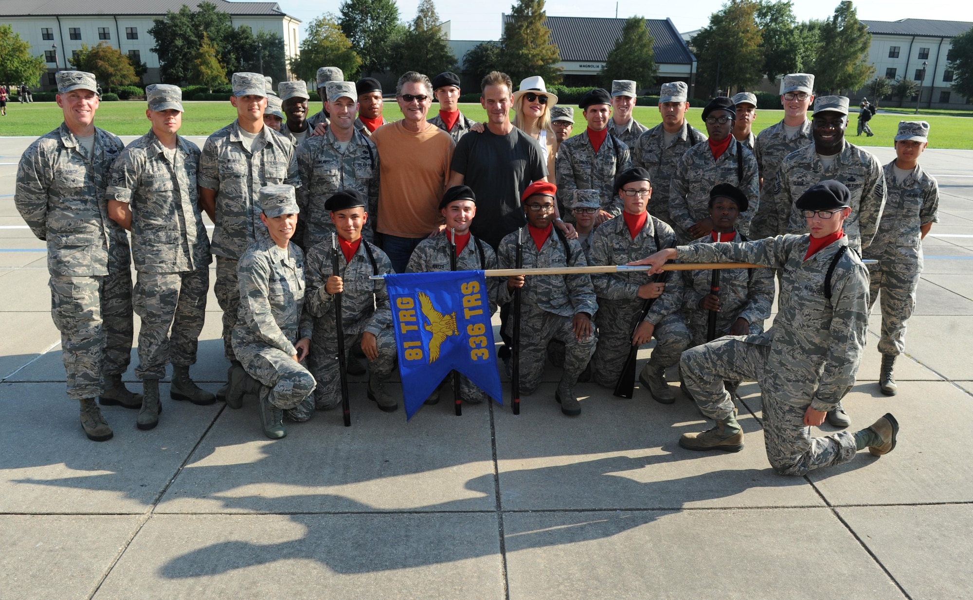 Kurt Russell, Kate Hudson, Deepwater Horizon actors, and Peter Berg, Deepwater Horizon director, pose for a photo with 336th Training Squadron drill team members at the Levitow Training Support Facility drill pad before the Deepwater Horizon movie screening Sept. 20, 2016, on Keesler Air Force Base, Miss. Before the screening, Russell, Hudson and Berg, took a short tour of the 81st Training Wing and 403rd Wing to meet with Airmen and learn about their missions at Keesler. (U.S. Air Force photo by Kemberly Groue/Released)