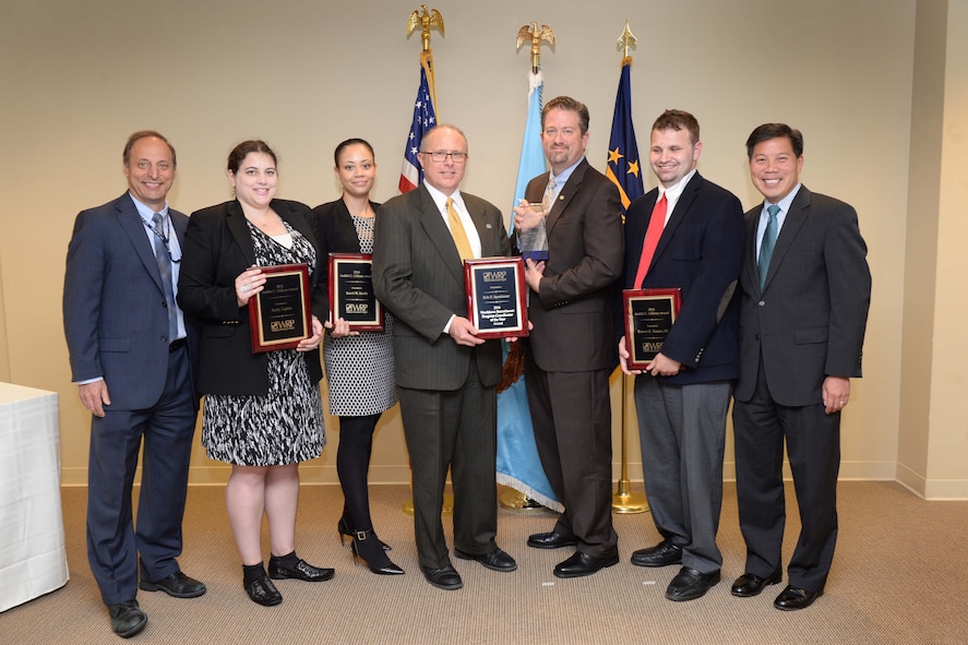 Left to right: Peter K. Levine, acting undersecretary of defense for personnel and readiness; award recipients Emily Lipkin, Kerri Smith, Eric Spanbauer, Brad Bunn and Robert Tanner; and Deputy Labor Secretary Christopher P. Lu pose for a photo during the 2016 Workforce Recruitment Program Award ceremony.