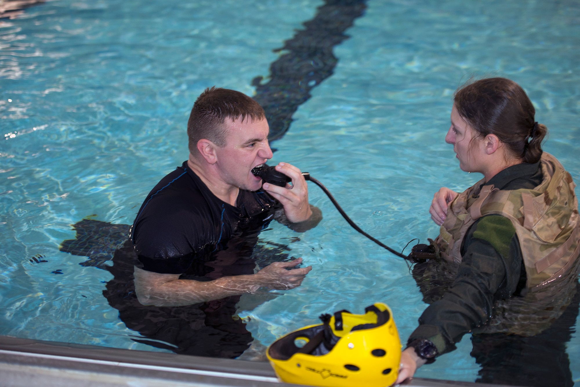 U.S. Air Force Tech. Sgt. Travis Siegwart, 347th Operations Support Squadron NCO in charge of survival, evasion, resistance and escape training, left, teaches Senior Airman Shelbi Bear, 41st Rescue Squadron special missions aviator, breathing techniques prior to water survival training, Sept. 15, 2016, at Moody Air Force Base, Ga. Bear says under Siegwart’s guidance, she gained confidence and comfort in her survival skills. (U.S. Air Force photo by Airman 1st Class Greg Nash)