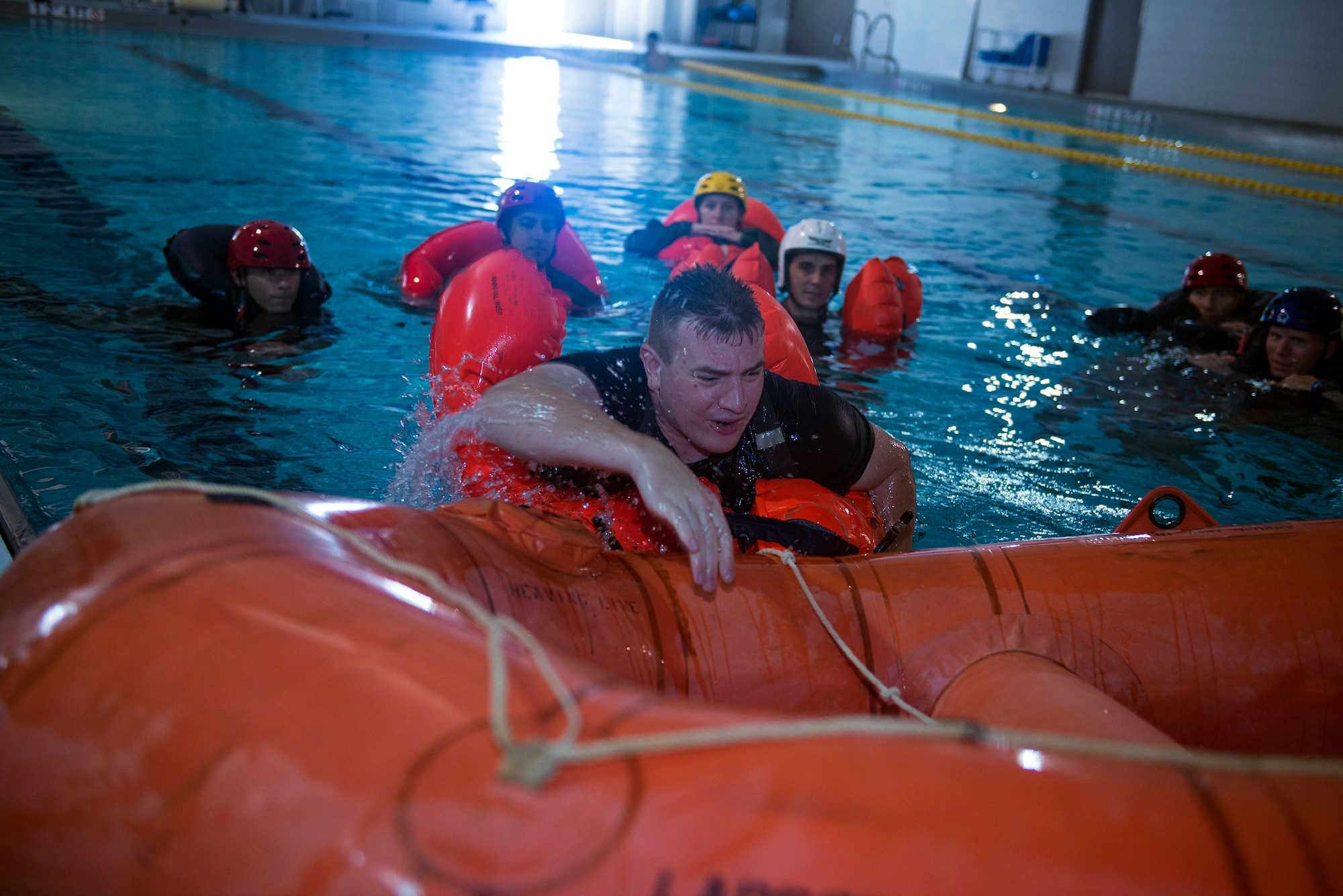 U.S. Air Force Tech. Sgt. Travis Siegwart, 347th Operations Support Squadron NCO in charge of survival, evasion, resistance and escape training, climbs into a raft during water survival training, Sept. 15, 2016, at Moody Air Force Base, Ga. The Michigan native’s rural upbringing and interest in his father’s stories from his Air Force career as an air crew member helped develop his passion in the SERE career field. (U.S. Air Force photo by Airman 1st Class Greg Nash)