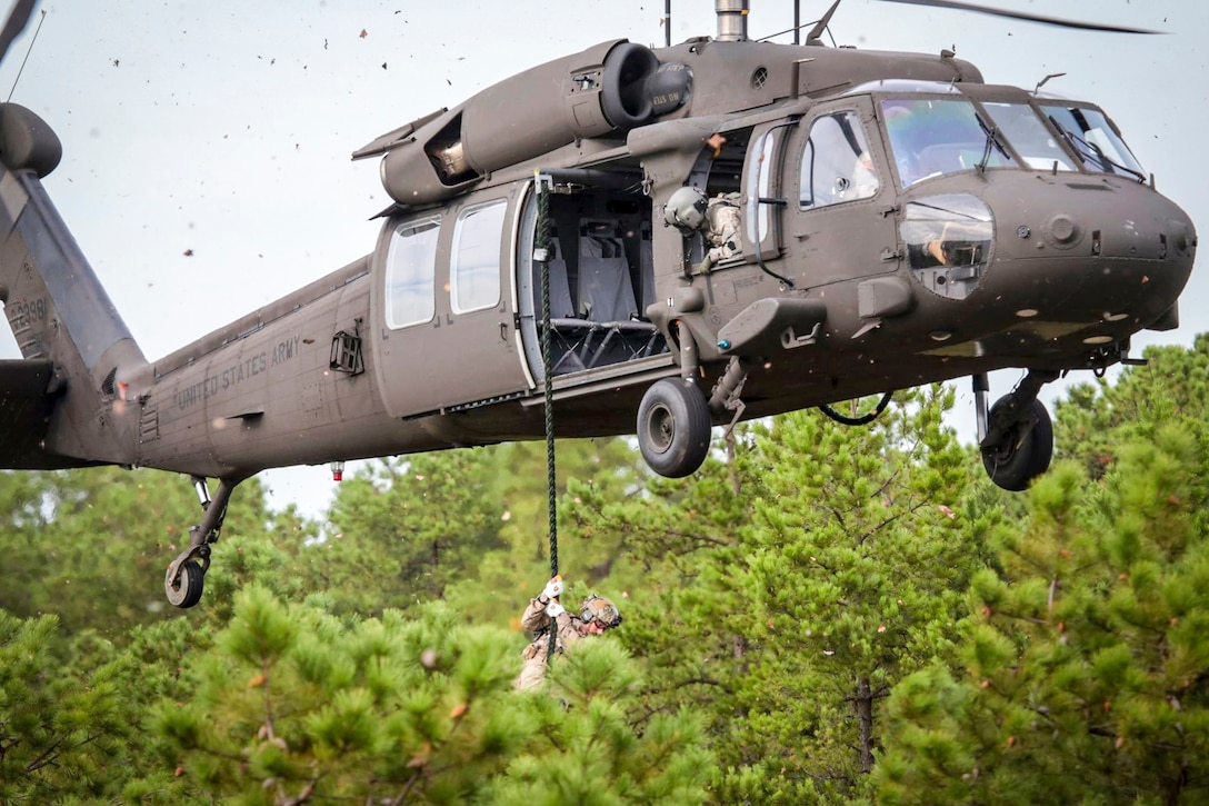 New Jersey Air National Guard airmen conduct fast-rope training from an Army UH-60 Black Hawk as as part of exercise Rail Yard at Warren Grove Gunnery Range, N.J., Sept. 21, 2016. National Guard photo by Air Force Tech. Sgt. Matt Hecht

