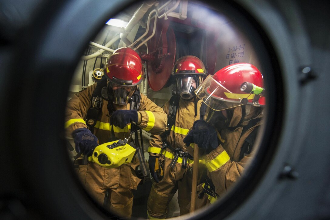 Sailors conduct a fire drill on the USS Spruance in the East Japan Sea, Sept. 20, 2016. The Spruance is supporting maritime security and stability in the Indo-Asia-Pacific region. Navy photo by Petty Officer 2nd Class Will Gaskill


