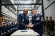 Brig. Gen. Trent Edwards, the Air Force Space Command director of financial management and comptroller and Chief Master Sgt. Brendan Criswell, the AFSPC command chief, use the ceremonial sword to cut the Air Force birthday cake, Sept. 16, 2016, at Peterson Air Force Base, Colo. More than 125 members from AFSPC attended the Air Force Birthday ceremony. (U.S. Air Force photo/Tech. Sgt. David Salanitri)