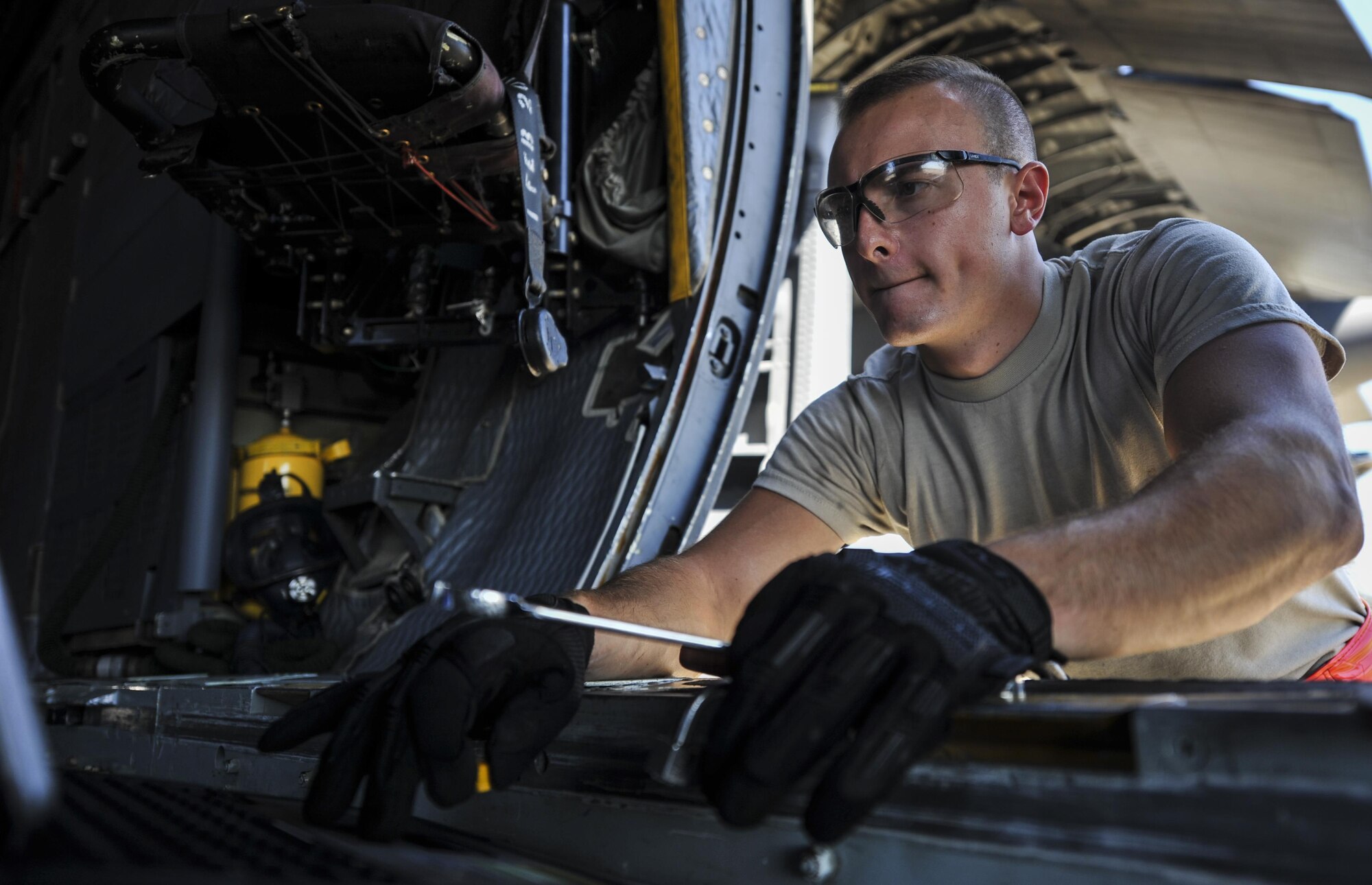 Airman 1st Class Nicolas Stamper, a crew chief with the 15th Aircraft Maintenance Unit, references a technical guide from a laptop at Hurlburt Field, Fla., Sept. 21, 2016. Crew chiefs with the 15th AMU are trained to diagnose malfunctions on the MC-130H Combat Talon II during pre-flight and post-flight inspections, repair and refuel the aircraft, keep detailed records, marshal aircraft and ensure the aircraft are mission ready at all times. (U.S. Air Force photo by Airman 1st Class Joseph Pick)