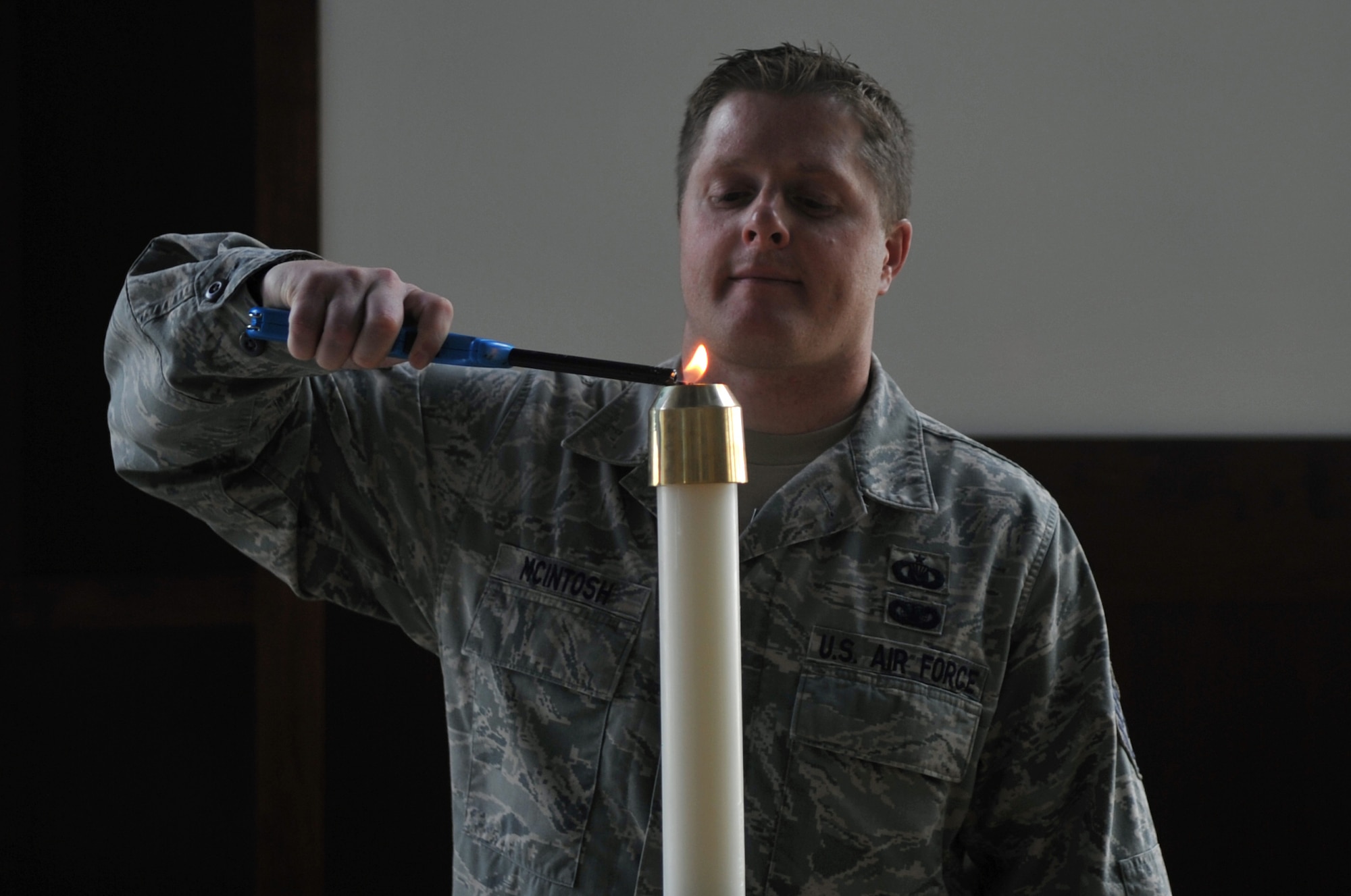 Tech Sgt. John P. McIntosh, 460th Space Wing chapel operations NCO in charge, lights a candle during a training to prepare for a chapel service September 15, 2016, at Buckley AFB, Colo. Although it’s not their normal duty to prepare the chapel for services, chaplain assistants are called upon to do so when deployed. (U.S. Air Force photo by Airman Holden S. Faul)