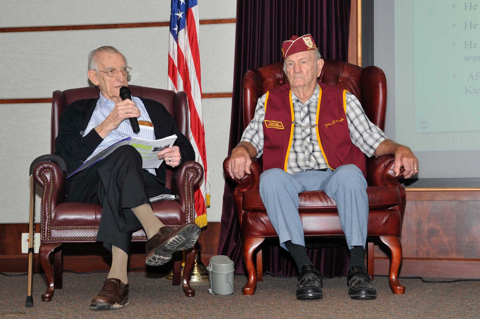 Walter Lawrence, left, and John Mock, World War II POWs, share their stories at a speaking event, Sept. 14, 2016, at McConnell Air Force Base, Kan. The men shared their stories of internment with McConnell’s Airmen during this year’s POW/MIA week. (U.S. Air Force photo/Airman Erin McClellan)