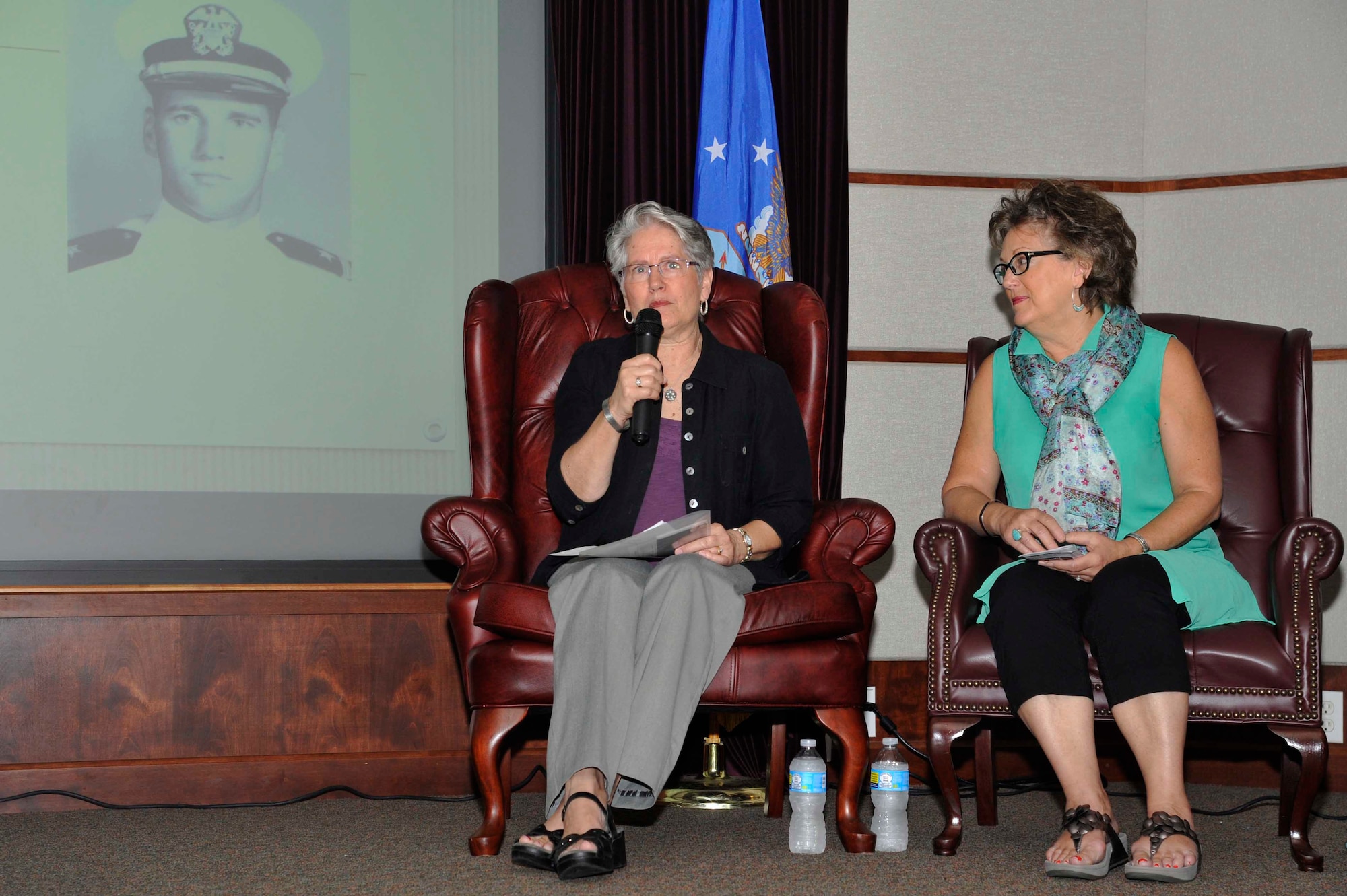 Sandie Anderson, left, and Martha Geiger, cousins of Navy Lt. James B. Mills, a radar intercept operator who was listed as missing in action, Sept. 21, 1966, speak during an MIA/POW event, Sept. 14, 2016, at McConnell Air Force Base, Kan. The women attended to share the story of their cousin and how they’ve dealt with losing him. (U.S. Air Force photo/Airman Erin McClellan)