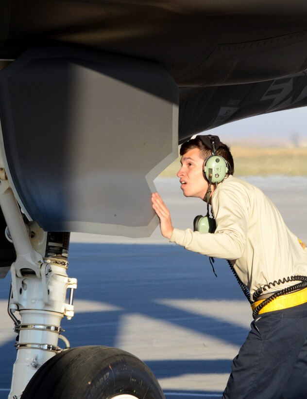Airman 1st Class Dennis Hesse, 61st Aircraft Maintenance Unit crew chief, inspects the wheel well and assembly September 16, 2016, prior to launching an F-35 Lightning II at Mountain Home Air Force Base, Idaho. Luke sent jets to Mountain Home AFB because it provides a unique opportunity for developing proficiency in the destruction of surface-to-air threats at their range complex. (U.S. Air Force photo by Tech. Sgt. Timothy Boyer)   