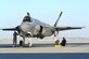 Airman 1st Class Nkosi Jones, left, 61st Aircraft Maintenance Unit weapons Airman, secures a panel while Staff Sgt. Martin De La Vara, 61st AMU crew chief, prepares to pull the chocks September 16, 2016, prior to launching an F-35 Lightning II at Mountain Home Air Force Base, Idaho. Luke sent jets to Mountain Home AFB because it provides a unique opportunity for developing proficiency in the destruction of surface-to-air threats at their range complex. (U.S. Air Force photo by Tech. Sgt. Timothy Boyer)