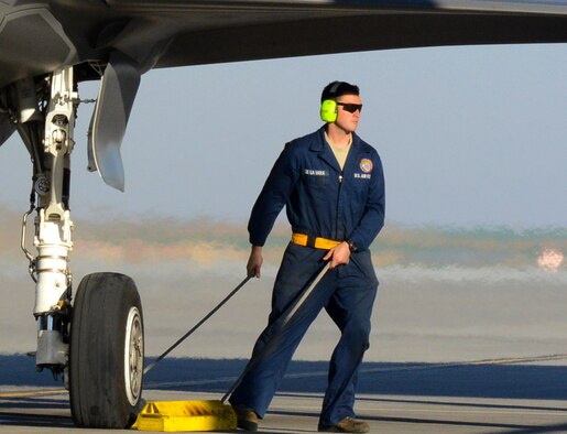Staff Sgt. De La Vara pulls the chocks September 16, 2016, prior to launching an F-35 Lightning II at Mountain Home Air Force Base, Idaho. Luke sent jets to Mountain Home AFB because it provides a unique opportunity for developing proficiency in the destruction of surface-to-air threats at their range complex. (U.S. Air Force photo by Tech. Sgt. Timothy Boyer)