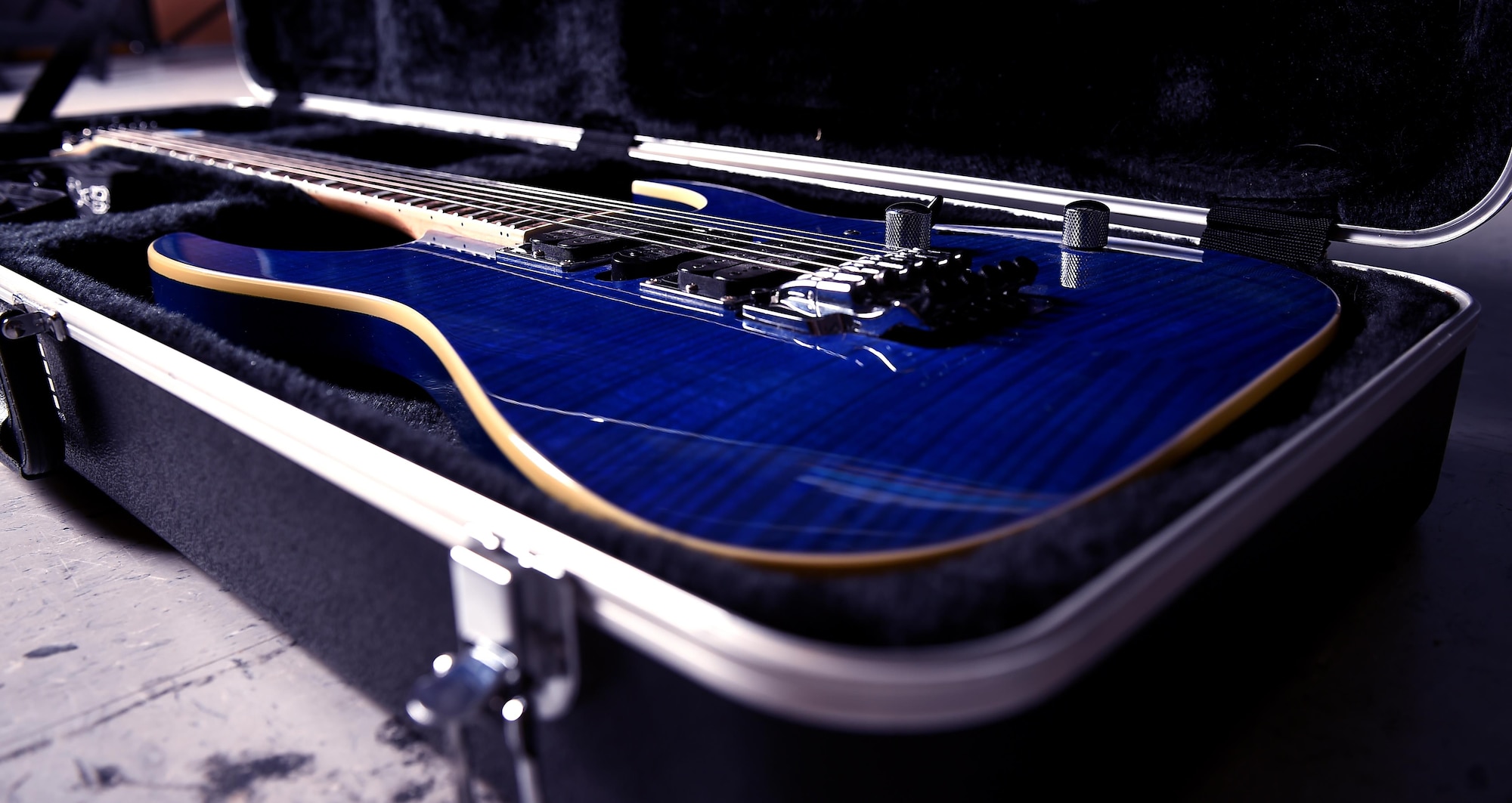 Airman 1st Class Zacary Heinzerling, 460th Security Forces Squadron apprentice, displays his 2009 transparent blue Ibanez guitar September 8, 2016, at Buckley Air Force Base, Colo. This guitar is one of nine owned by Heinzerling, who has been playing music since he was 10 years old. (U.S. Air Force photo by Airman Holden S. Faul/ Released) 