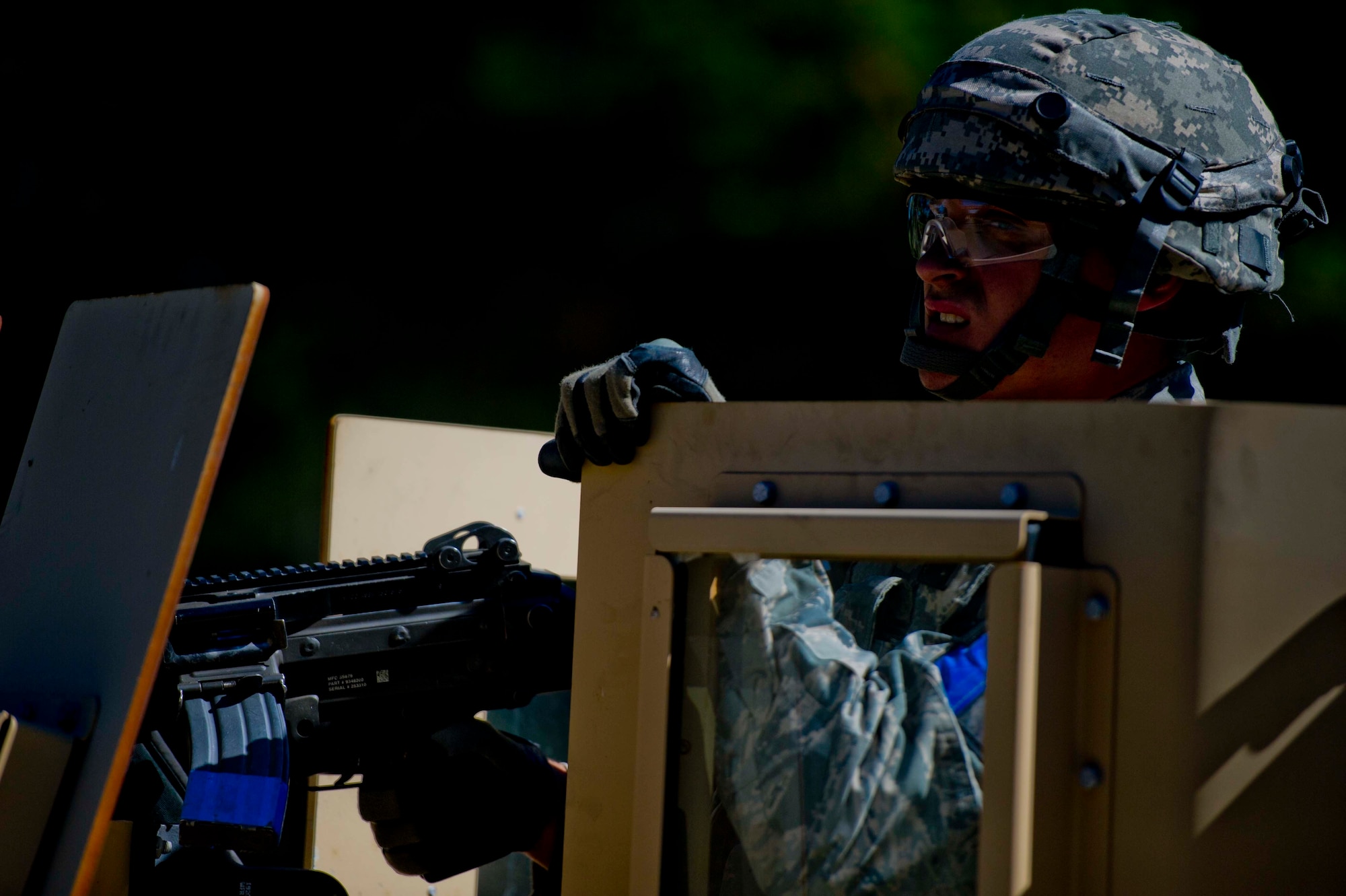 A Citizen Airman from the 446th Security Forces Squadron focuses while riding in an armored vehicle during a large-scale Field Training Exercise at Joint Base Lewis-McChord September 8 - 11th. The exercise challenged SFS members to train in an expeditionary environment and included U.S. Army aviation assets and 446th Airlift Wing medical personnel. (U.S. Air Force Reserve photo by Staff Sgt. Daniel Liddicoet)