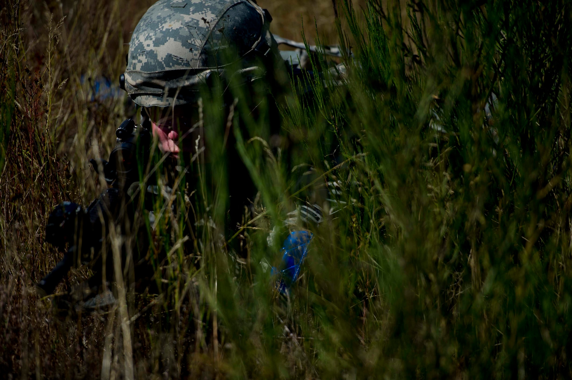 A Citizen Airman from the 446th Security Forces Squadron is in position participating in a large-scale Field Training Exercise at Joint Base Lewis-McChord September 8 - 11th. The exercise challenged SFS members to train in an expeditionary environment. (U.S. Air Force Reserve photo by Staff Sgt. Daniel Liddicoet)