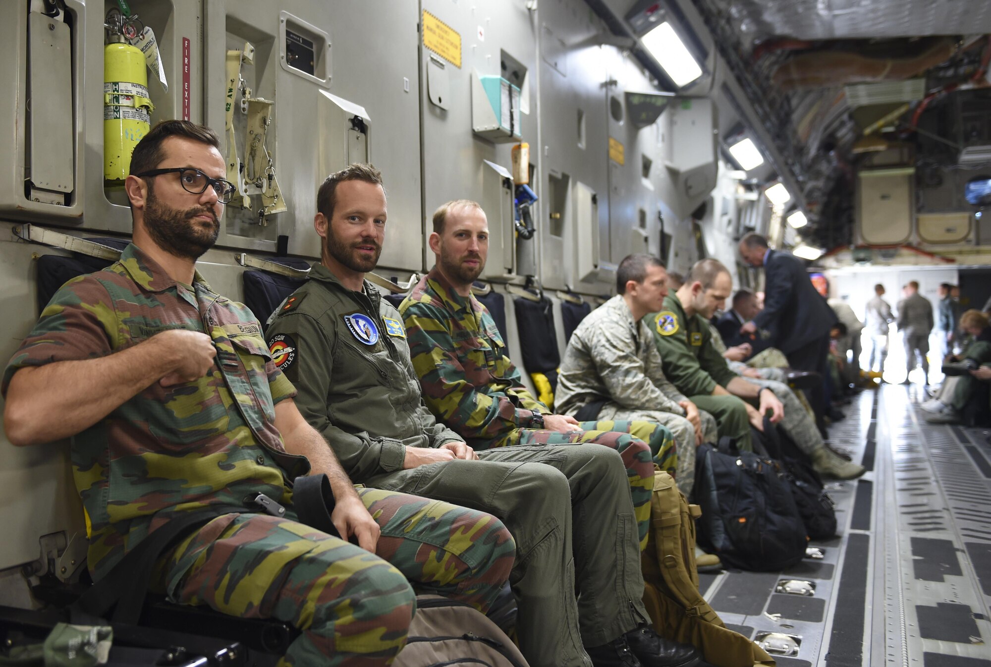 A Belgium air crew sit on board a McChord C-17 Globemaster III on the McChord Field flight line before departing to Grant County International Airport a.k.a. Moses Lake Sept. 21, 2016. Eight nations visited the base as part of Air Mobility Command’s Mobility Guardian in progress review at Joint Base Lewis-McChord, Washington. (Air Force photo/ Staff Sgt. Naomi Shipley)