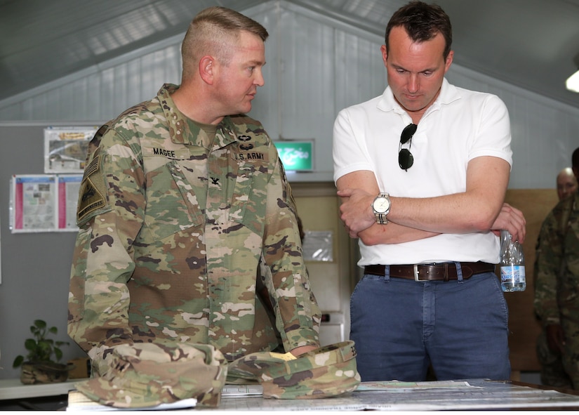 Col. Robert E. Lee Magee, commander of the 3rd Armored Brigade Combat Team, 1st Infantry Division, left, discusses his operations with Secretary of the Army Eric Fanning during a tour Sept. 19 at Camp Buehring, Kuwait. Fanning met with U.S. Army Central Soldiers throughout Kuwait who support missions in 20 countries in the Middle East and Southwest Asia. (U.S. Army photo by Sgt. Brandon Hubbard)
