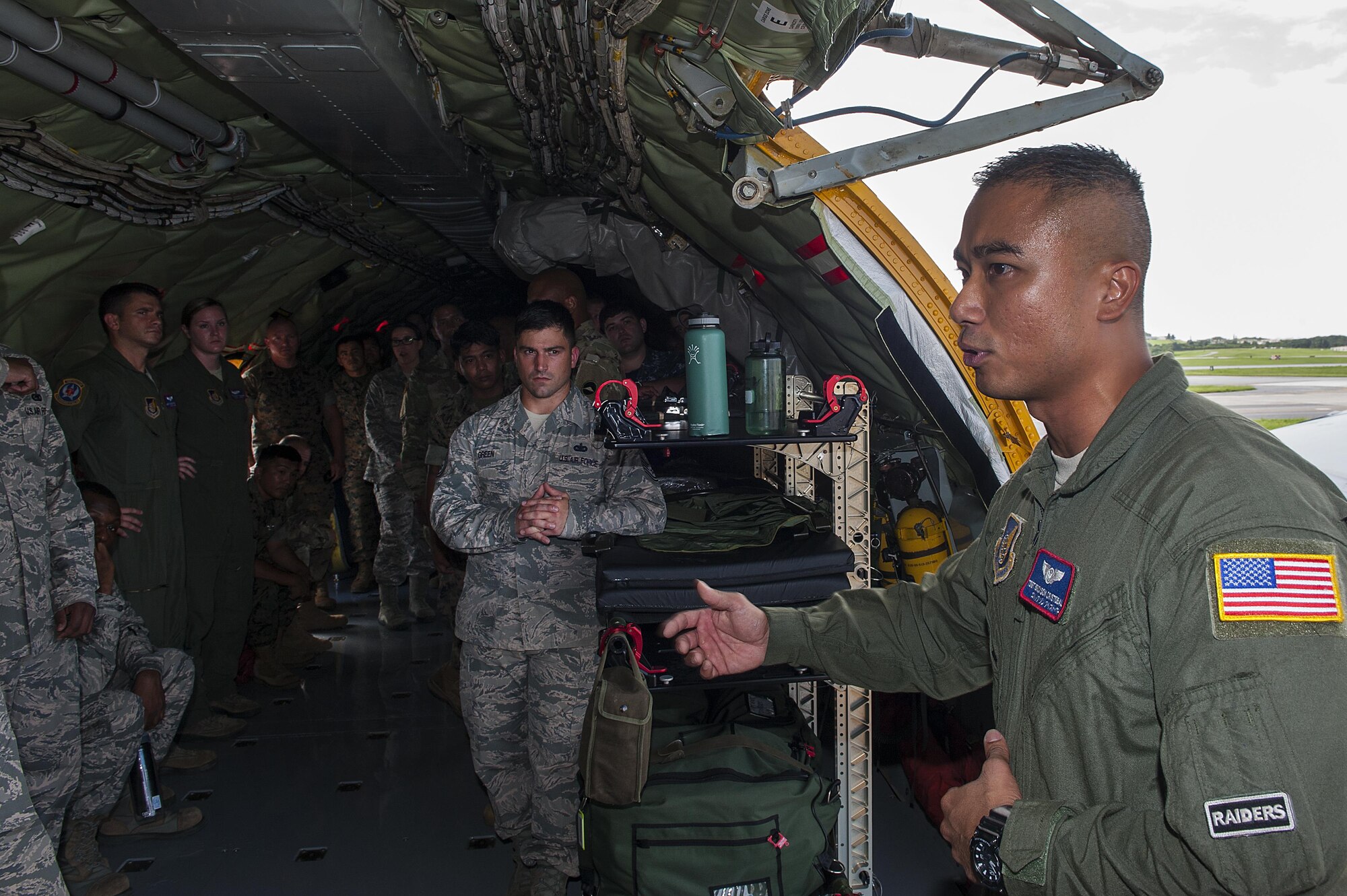 U.S. Air Force Tech Sgt. Erickson Cristobal, 18th Aeromedical Evacuation Squadron aeromedical technician, explains his role in the aeromedical mission to students attending the Joint Professional Military Education Okinawa Experience Sept. 19, 2016, at Kadena Air Base, Japan. The Joint PME gives enlisted leaders the opportunity to get a better grasp of other service’s mission and role in the Pacific. (U. S. Air Force photo by Airman 1st Class Corey M. Pettis)