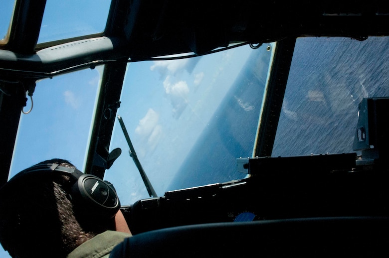 A U.S. Air Force pilot from the Georgia Air National Guard's 165th Airlift Wing executes evasive maneuvers while being escorted by fighters during Sentry Aloha at Joint Base Pearl Harbor-Hickam, Hawaii on Aug. 29 2016. This iteration of Sentry Aloha involved over 800 personnel and over 40 aircraft from eight other states and territories. (U.S. Air National Guard photo by Airman 1st Class Stan Pak/released)