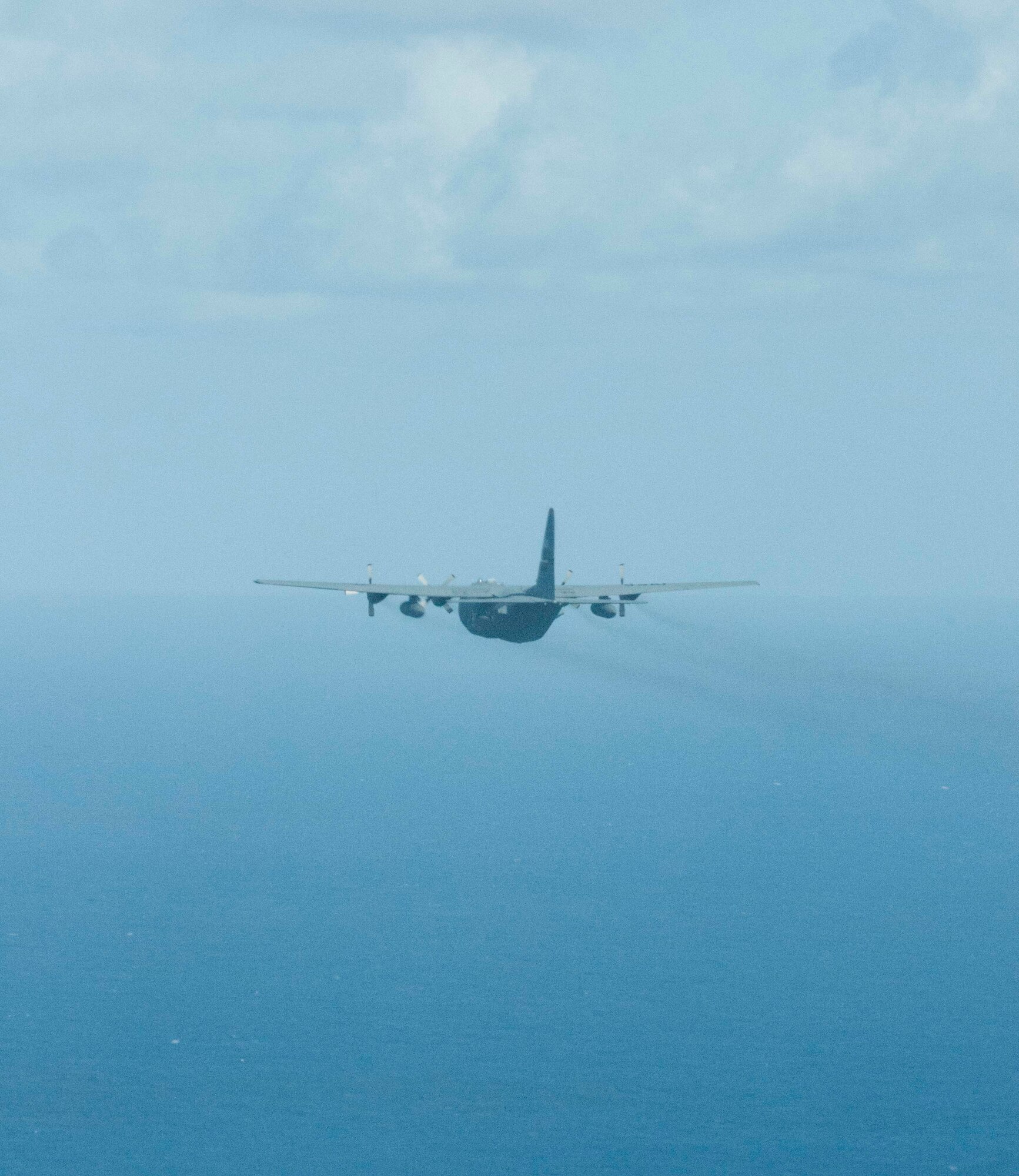 A U.S. Air Force C-130 Hercules from the Georgia Air National Guard's 165th Airlift Wing flies towards the horizon on a sortie during Sentry Aloha at Joint Base Pearl Harbor-Hickam, Hawaii on Aug. 29 2016. Sentry Aloha is an ongoing series of combat exercises hosted by the Hawaii Air National Guard and involves a variety of fighter and support aircraft from varying Air Force, Air National Guard, and DoD participants. (U.S. Air National Guard photo by Airman 1st Class Stan Pak/released)