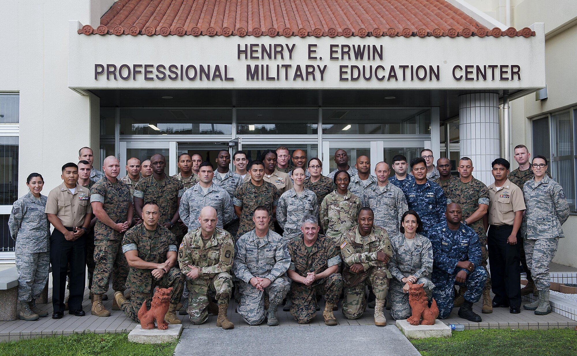 Students attending the Joint Professional Military Education Okinawa Experience pose with senior enlisted leaders from around Okinawa Sept. 19, 2016, at Kadena Air Base, Japan. Enlisted leaders from across Okinawa joined forces for a week-long joint professional military education experience to learn the mission of their fellow service members. (U.S. Air Force photo by Airman 1st Class Corey M. Pettis)