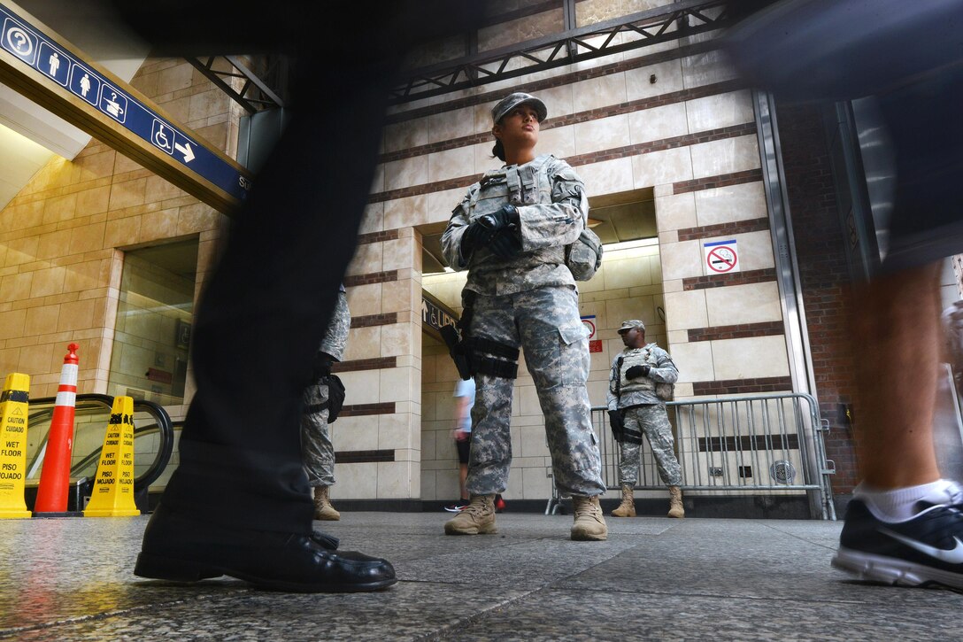 A New York Army National Guardsman patrols the Penn Station subway station in New York City, Sept. 20, 2016, following the recent bombings in Manhattan and New Jersey. New York Air National Guard photo by Staff Sgt. Christopher S. Muncy



