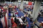 Members of the American Legion explore the exhibit hall Aug. 30, 2016, during the American Legion’s 98th National Convention in Cincinnati. The convention brought together more than 8,000 members discus positions, policies, and resolutions for the upcoming year. (DoD photo by Staff Sgt. Jocelyn Ford/USAF)