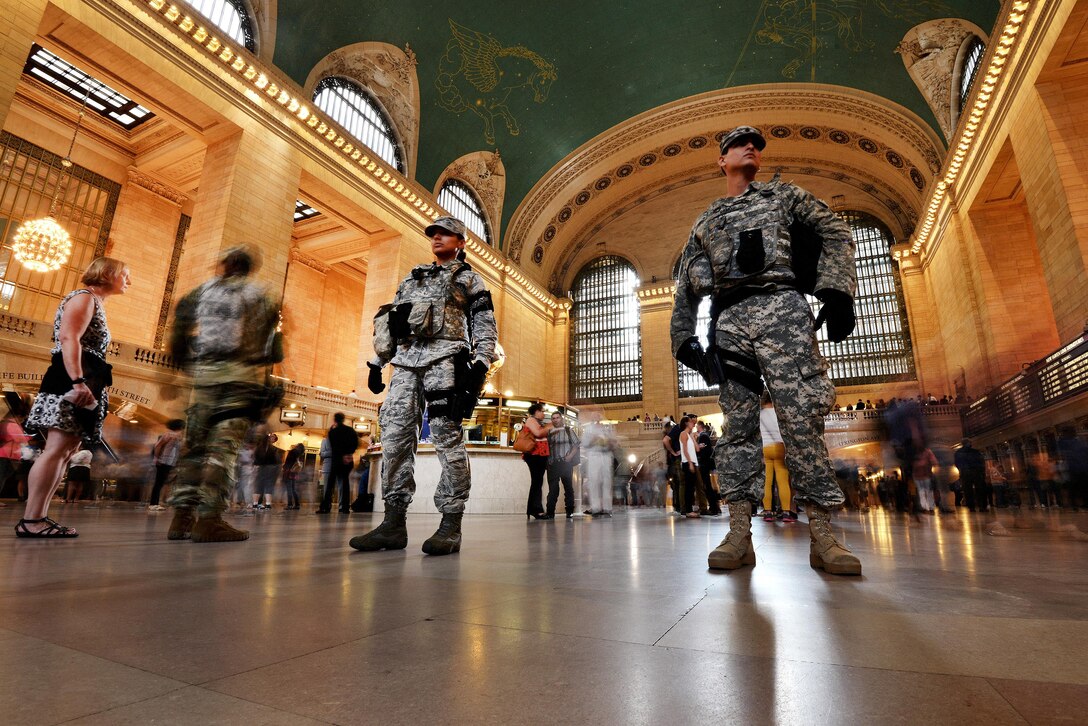 New York Air National Guard Senior Airman Ashley Espin, center, and New York Army National Guard Spc. Casimir Remond, left, patrol Grand Central Station in New York City, Sept. 20, 2016, following the recent bombings in Manhattan and New Jersey. The Guardsmen are members of Joint Task Force Empire Shield. New York Air National Guard photo by Staff Sgt. Christopher S. Muncy


