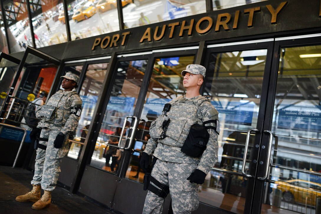New York Army National Guard Spc. Luis Gustav Postigovalverde, right, and Pfc. Dion Hani Martin patrol the Port Authority Bus Terminal in New York City, Sept. 21, 2016, following the recent bombings in Manhattan and New Jersey. Postigovalverde, and Martin are members of Joint Task Force Empire Shield. New York Air National Guard photo by Staff Sgt. Christopher S. Muncy




