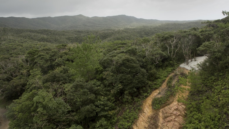A cliff used for rappelling overlooks the Jungle Warfare Training Center Sept. 20 on Okinawa, Japan. Since 1958, the Jungle Warfare Training Center has provided terrain and climate-specific training to units serving across the Asia-Pacific region. The training area stretches over more than 17,000 acres and the courses offered reinforce service members’ ability to carry out tactical operations in the jungle. This training area made up more than 17,000 acres of mountains and jungle, is the only one of its kin din the entire Department of Defense.
