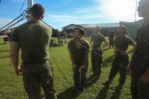 Marines inspect parts of a mast of a Meteorological Radar Subsystem during the installation at Marine Corps Air Station New River, N.C., Sept. 14, 2016. The MRS, put together by Marines with Meteorology and Oceanography platoon, 2nd Intelligence Battalion, and Marine Air Traffic Control Detachment Bravo, Marine Air Traffic Control Squadron 2, is used by forecasters to accurately predict cloud cover and possible natural disasters. (U.S. Marine Corps photo by Lance Cpl. Ashley Lawson/Released)