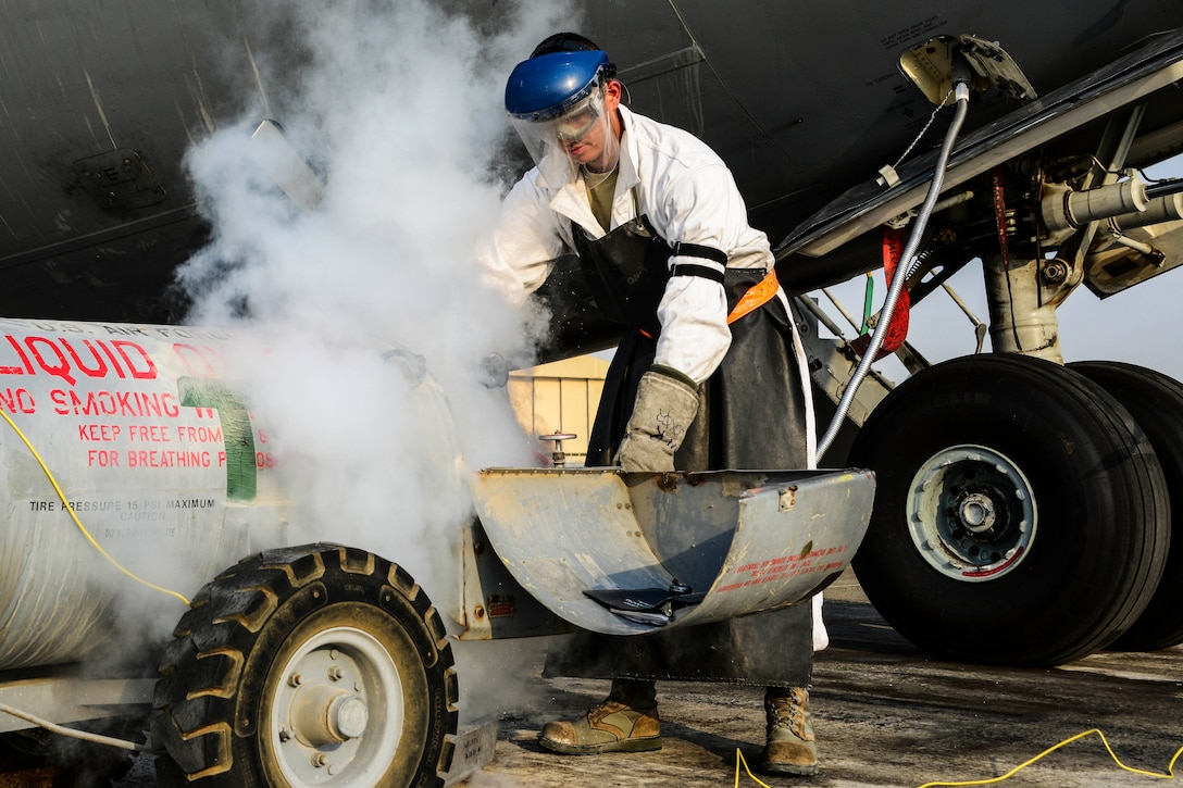 Senior Airman Christopher Martinez, 8th Expeditionary Air Mobility Squadron crew chief, purges a tank of liquid oxygen as he recharges a C-17 Globemaster III at Al Udeid Air Base, Qatar, Sept. 3, 2016. Martinez joined the Air Force in November 2013 to follow his father’s footsteps as a crew chief and later on cross-trained to the electrical field. Air Force photo by Senior Airman Janelle Patiño