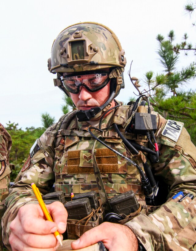 An Air Force tactical air control airman takes down a nine-line medical evacuation request during exercise Rail Yard at Warren Grove Gunnery Range, N.J., Sept 21, 2016. Air National Guard photo by Tech. Sgt. Matt Hecht