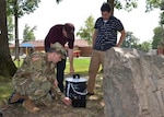 Army 1st Lt. Kyle Fortner, an environmental officer from Fort Lee, Virginia’s Kenner Army Health Clinic, installs a battery-operated mosquito collection system near the child development center July 19, 2016 on the Defense Supply Center Richmond, Virginia, while Defense Logistics Agency Installation Support at Richmond environmental staff members assist. Two traps collect mosquitos for Zika virus testing each week during the mosquito season. 