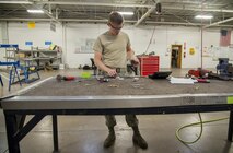 Airmen 1st Class Jacob Dollar, 5th Maintenance Squadron aircraft structural maintenance apprentice, rivets aircraft parts together at Minot Air Force Base, N.D., Sept. 20, 2016. Structural maintenance is charged with repairing B-52 Stratofortresses to ensure they remain aerodynamic and able to complete the mission of the 5th Bomb Wing.  (U.S. Air Force photo/Airman 1st Class Christian Sullivan)