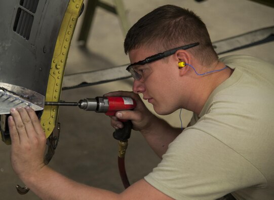 Senior Airman Adam Hess, 5th Maintenance Squadron aircraft structural maintenance journeyman, hand-forms and drills an aircraft part for a B-52H Stratofortress engine cowl at Minot Air Force Base, N.D., Sept. 20, 2016. Structural maintenance is charged with repairing B-52 Stratofortresses to ensure they remain aerodynamic and able to complete the mission of the 5th Bomb Wing. (U.S. Air Force photo/Airman 1st Class Christian Sullivan)