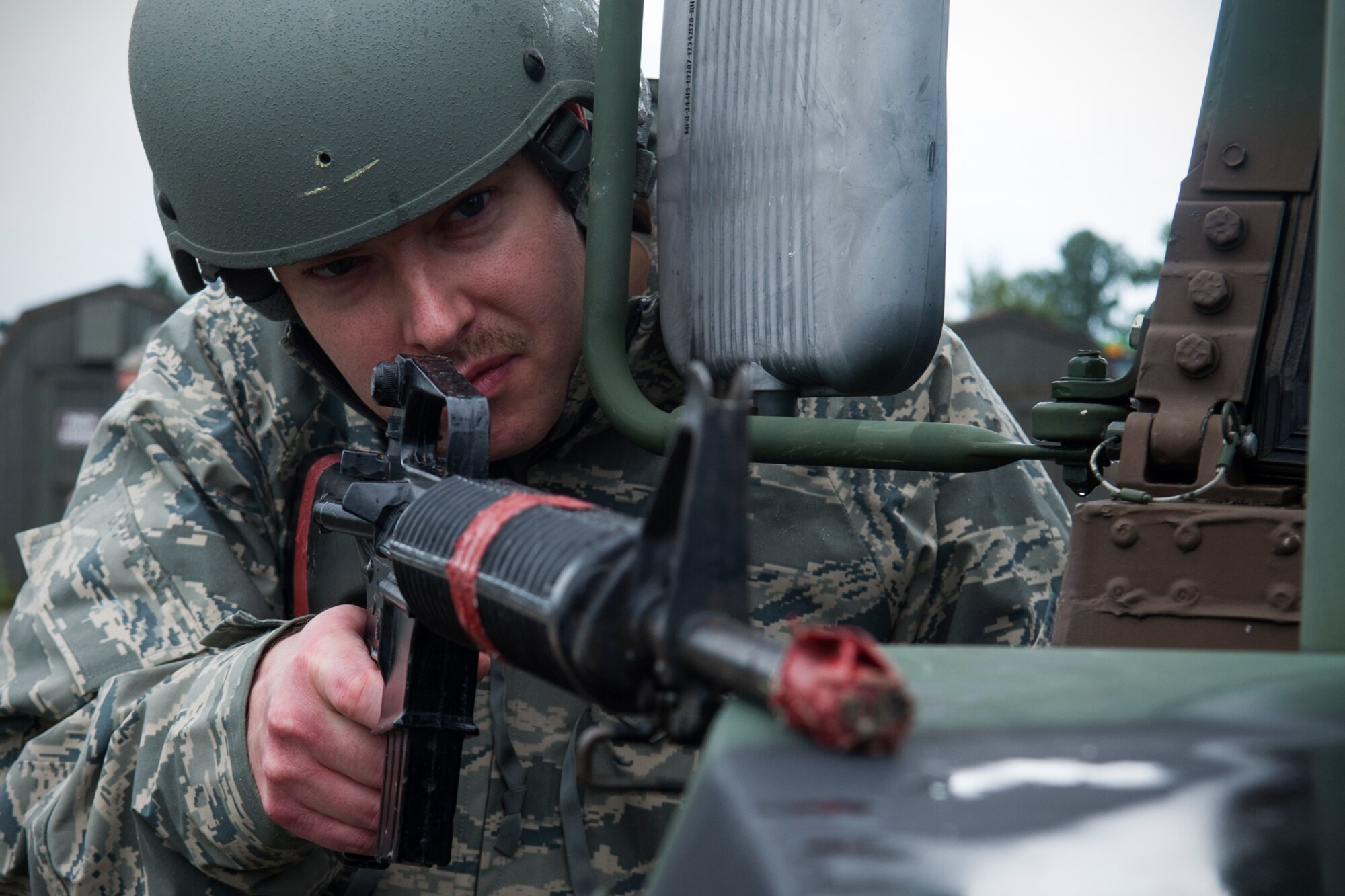 Tech. Sgt. Shawn Minnich, 434th Civil Engineer Squadron water and fuels technician, looks for simulated unexploded ordnance during a CE exercise Sept. 10, 2016 at Grissom Air Reserve Base, Ind. The exercise was meant to demonstrate a whole squadron response to base recovery, sustainment and protection through a combination of civil engineering and emergency response capabilities. (U.S. Air Force photo/Staff Sgt. Katrina Heikkinen)