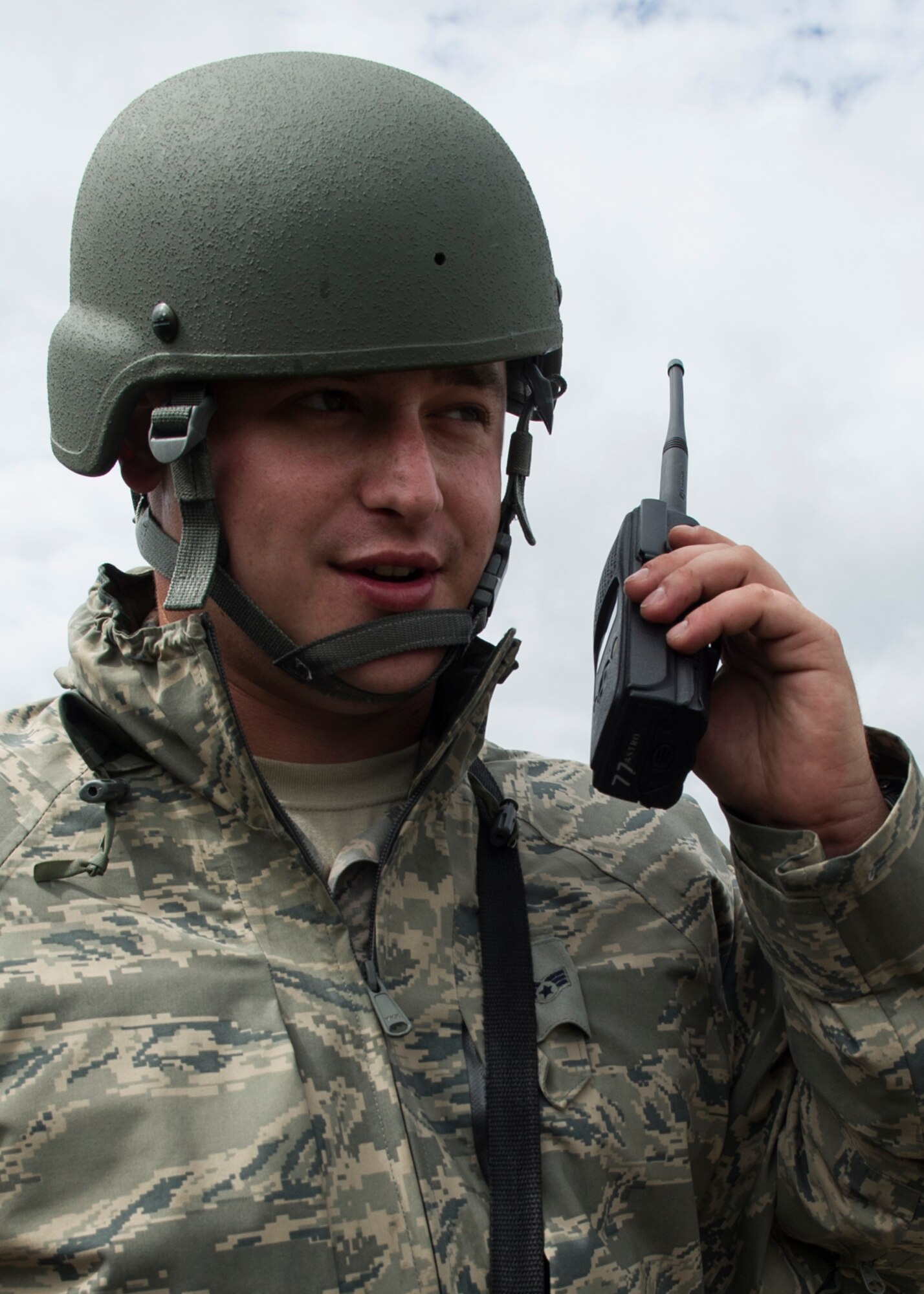 Senior Airman Mitch Dzierzbicki, 434th Civil Engineer Squadron emergency management apprentice, calls in a simulated unexploded ordinance to Explosive Ordinance Disposal during an exercise Sept. 10, 2016 at Grissom Air Reserve Base, Ind. The exercise provided a unique training opportunity for CES Airmen. (U.S. Air Force photo/Staff Sgt. Katrina Heikkinen)