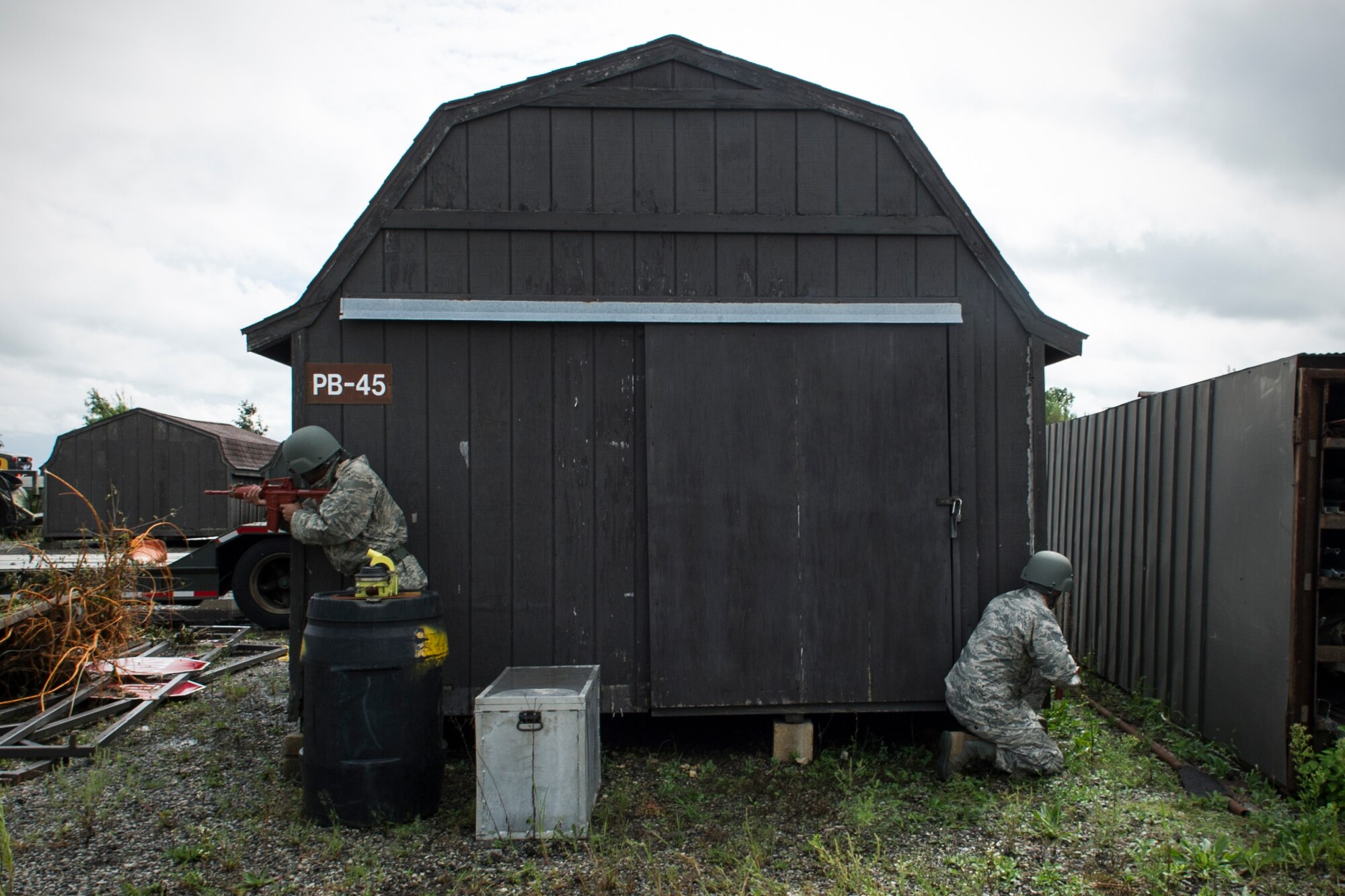 Senior Airman David Ruffin, 434th Civil Engineer Squadron power production journeyman, and Staff Sgt. Daniel Bennett, 434th Civil Engineer Squadron electrical systems technician, perform a security sweep during an exercise Sept. 10, 2016 at Grissom Air Reserve Base, Ind. When deployed CE Airmen are occasionally required to supplement security forces. (U.S. Air Force photo/Staff Sgt. Katrina Heikkinen)