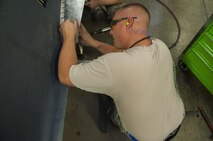 Master Sgt. Jeffrey Kinlaw, 5th Maintenance Squadron aircraft structural maintenance section chief, repairs an aircraft part for a B-52H Stratofortress engine cowl at Minot Air Force Base, N.D., Sept. 20, 2016. Structural maintenance provide equipment maintenance, both on and off of the B-52, special support on the Minuteman III missiles and UH-1N helicopters. (U.S. Air Force photo/Airman 1st Class Christian Sullivan)