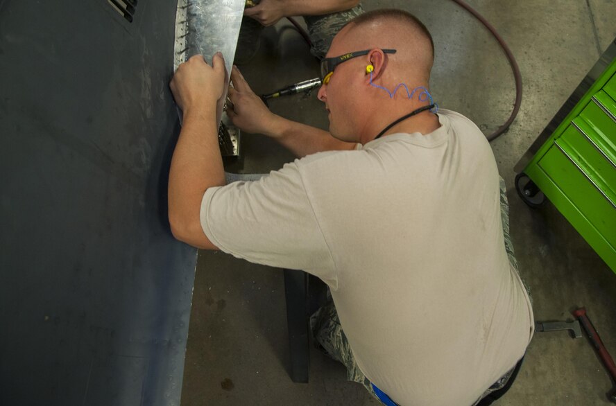 Master Sgt. Jeffrey Kinlaw, 5th Maintenance Squadron aircraft structural maintenance section chief, repairs an aircraft part for a B-52H Stratofortress engine cowl at Minot Air Force Base, N.D., Sept. 20, 2016. Structural maintenance provide equipment maintenance, both on and off of the B-52, special support on the Minuteman III missiles and UH-1N helicopters. (U.S. Air Force photo/Airman 1st Class Christian Sullivan)