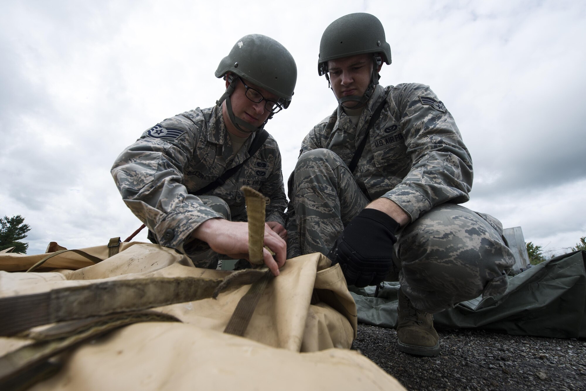 Staff Sgt. Thomas Boller, 434th Civil Engineer Squadron emergency management journeyman, and Senior Airman Thomas White, 434th Civil Engineer Squadron heavy equipment journeyman, participate in an exercise Sept. 10, 2016 at Grissom Air Reserve Base, Ind. The exercise provided a unique training opportunity for CES Airmen. (U.S. Air Force photo/Staff Sgt. Katrina Heikkinen)