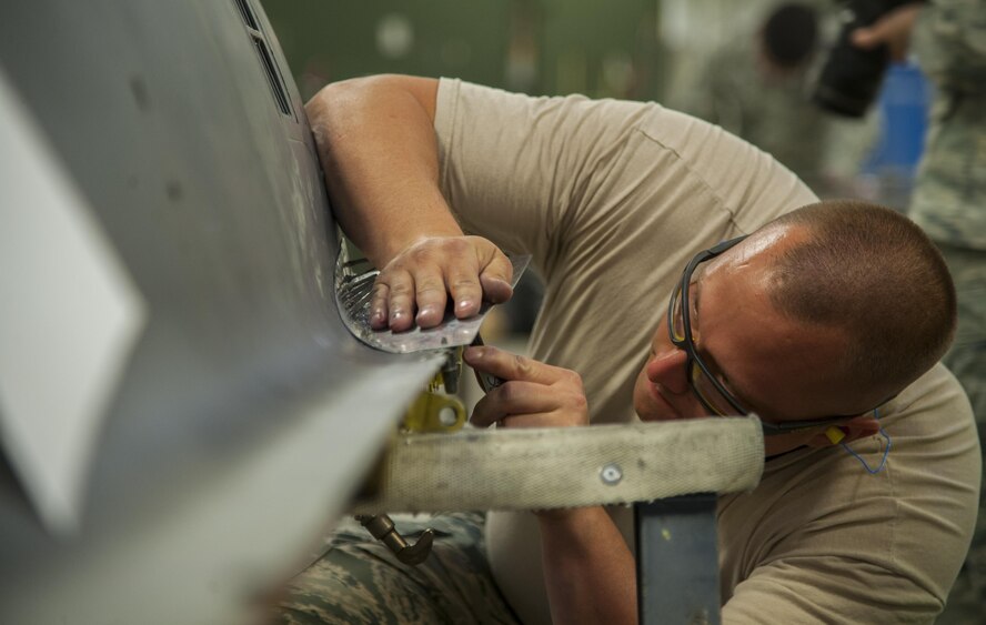 Master Sgt. Jeffrey Kinlaw, 5th Maintenance Squadron aircraft structural maintenance section chief, hand-forms a body part for a B-52H Stratofortress at Minot Air Force Base, N.D., Sept. 20, 2016. The 5th MXS provides Minot AFB with munition maintenance, aircraft maintenance and maintenance operations support. (U.S. Air Force photo/Airman 1st Class Christian Sullivan)
