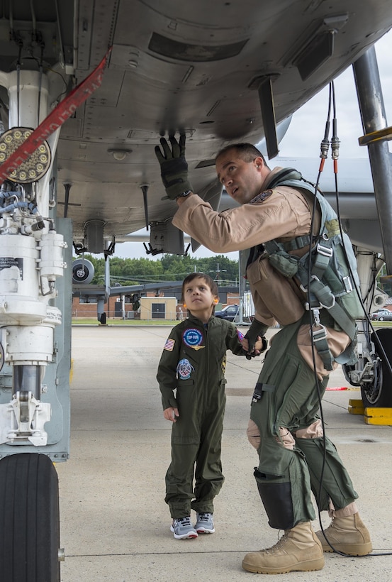Jack Kirkbride and U.S. Air Force Maj. Steven Montalvo a pilot assigned to the 104th Fighter Squadron, conduct  pre inspection checks prior to aircraft launch at the Warfield Air National Guard in Middle River, Maryland, Sept. 17, 2016. The five year old from Crofton was honored as an A10 Thunderbolt II attack Pilot for a Day.