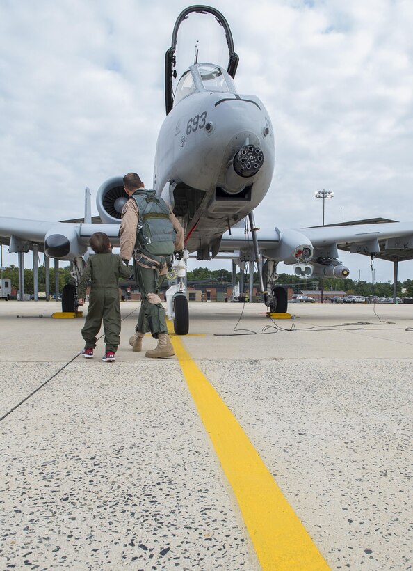 Jack Kirkbride and U.S. Air Force Maj. Steven Montalvo a pilot assigned to the 104th Fighter Squadron, conduct  pre inspection checks prior to aircraft launch at the Warfield Air National Guard in Middle River, Maryland, Sept. 17, 2016. The five year old from Crofton was honored as an A10 Thunderbolt II attack Pilot for a Day. 