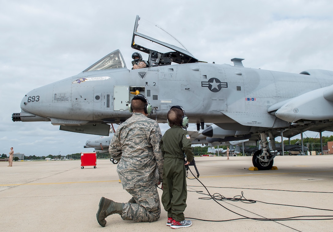 Jack Kirkbride conducts a precheck of the aircraft with an Air Force crew chief assigned to the 104th Fighter Wing, prior to takeoff on the Warfield Air National Guard runway in Middle River, Maryland, Sept. 17, 2016. Jack was given honorary wings and a lifetime membership to the Maryland Air National Guard 175th Fighter Wing.