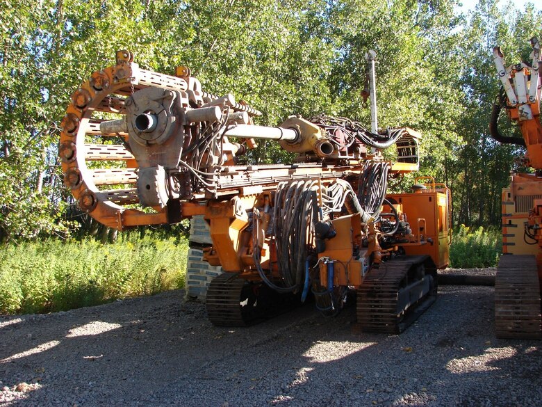 Drilling Rig used for drilling through rocks allowing grout to be pumped, repairing gaps between filtering stone and sheet pile, August 25, 2010.